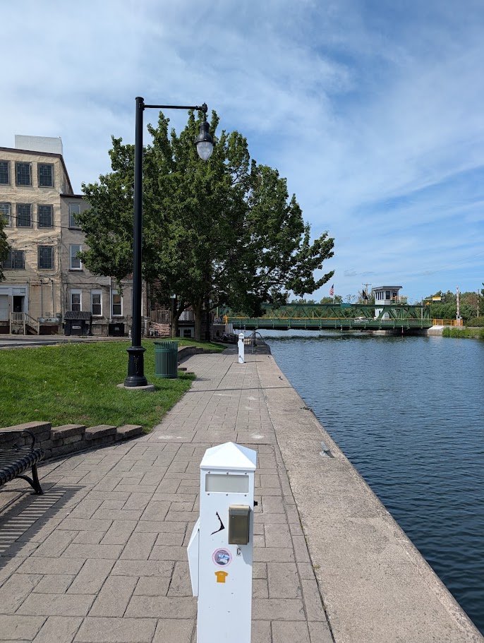 Outdoor tables near the water.